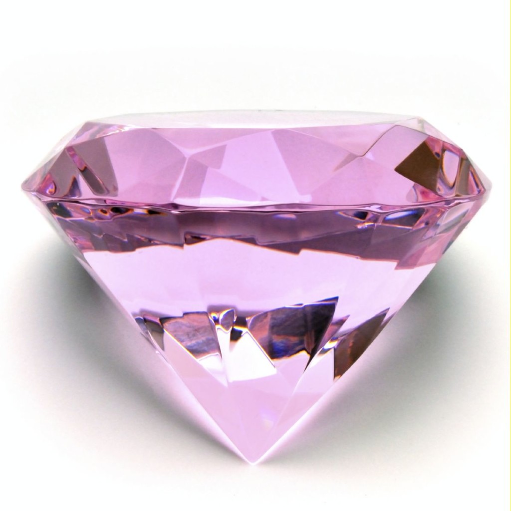 Close-up of a large pink gem on a white background.