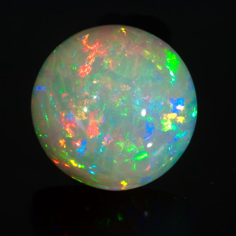 Round cabochon white opal from Ethiopia.